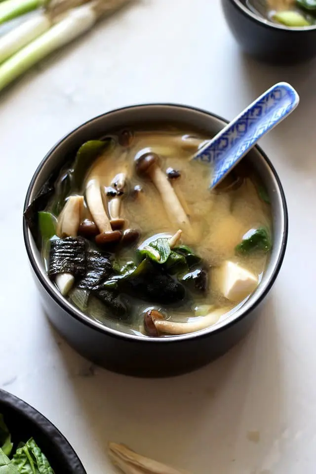 Easy Miso Soup (Japanese Clear Soup) - Closeup on a Bowl Full of Mushrooms and Other Delicious Ingredients
