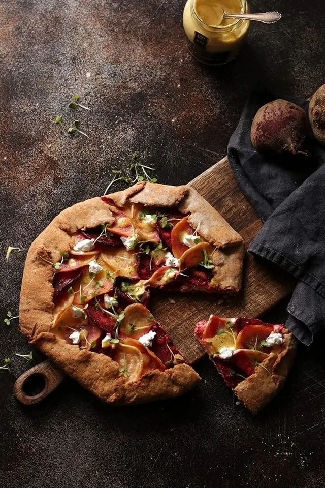 Beet Galette with Goat Cheese on a Wooden Board