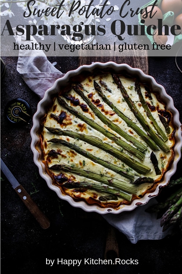Asparagus Quiche in a Pie Pan After Baking Next to Eggs and a Knife