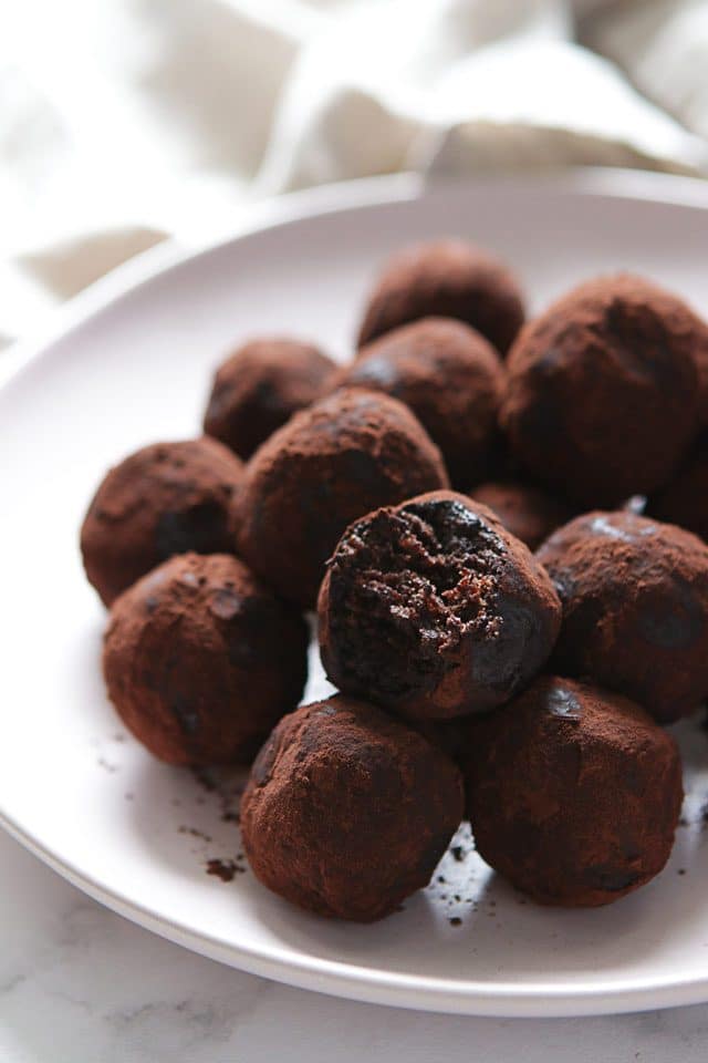 Delicious Energy Balls Coated with Cocoa Powder on a Plate