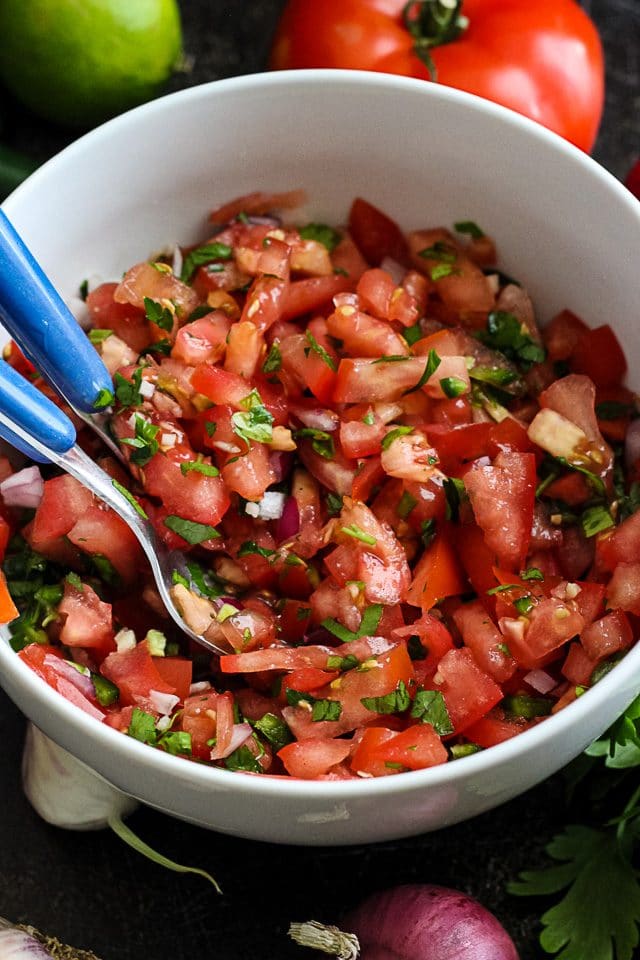 Fresh Tomato Salsa in a Bowl with Utencils