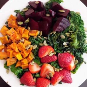 Harvest Kale Salad with sweet potatoes, Beets, Strawberries and Pumpkin seeds.