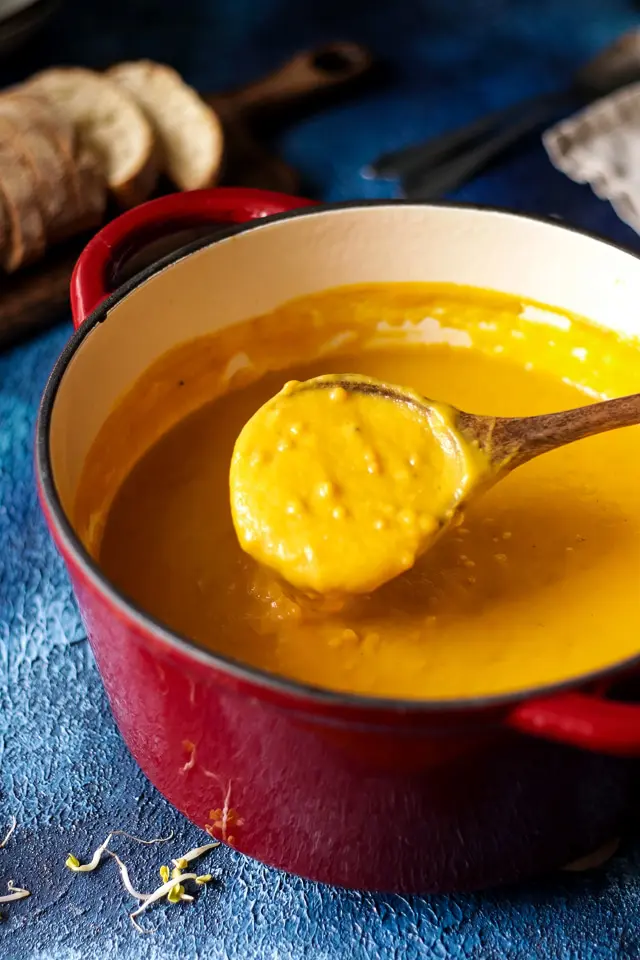 Sweet Potato Lentil Soup in a Pot with a Spoon