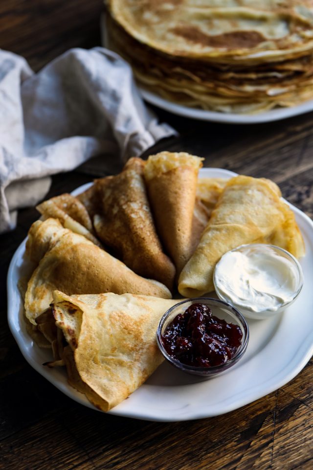 Russian blini with sour cream and jam.