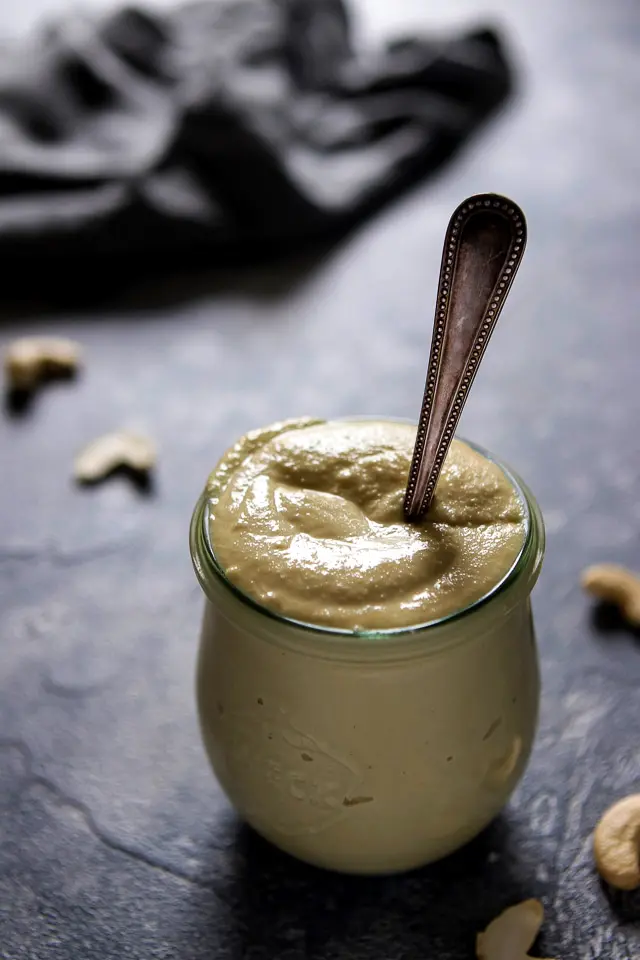 Vegan Cashew Mayonnaise in a Jar with a Spoon