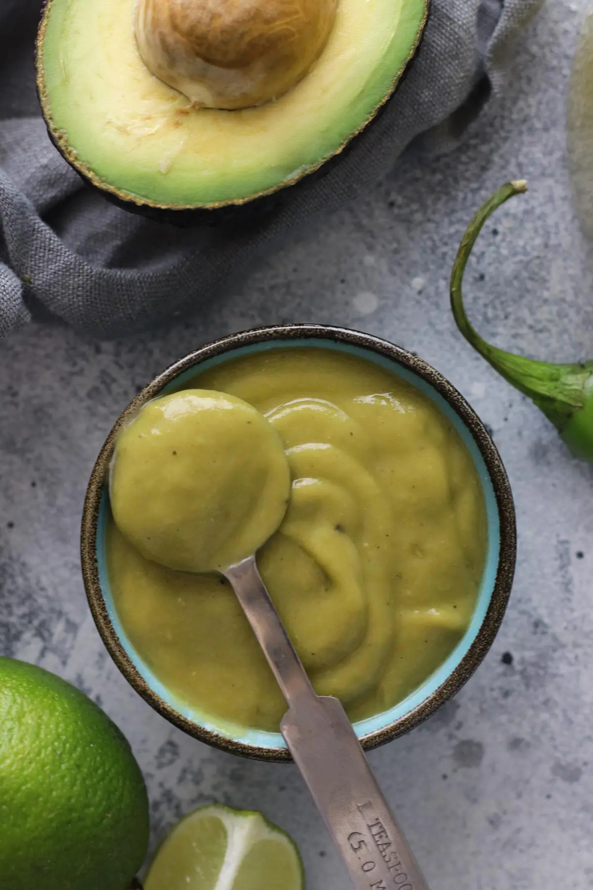 Avocado Sauce in a Bowl with a Spoon.