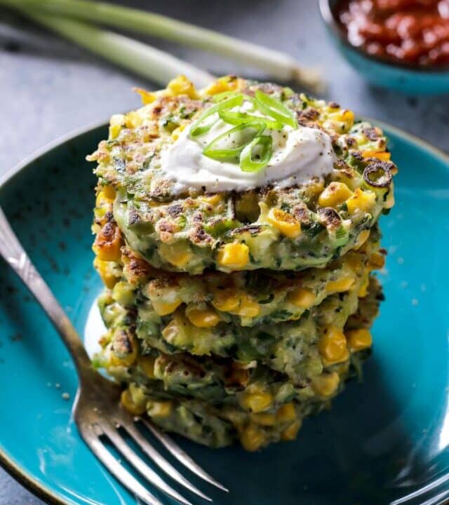 Vegan Zucchini Corn Fritters Stalked on a Plate