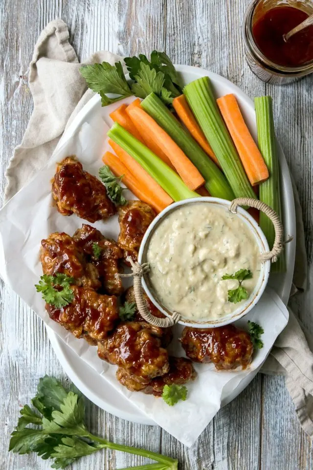 Vegan Blue Cheese Dressing with Vegan Wings, Carrot and Celery Sticks.