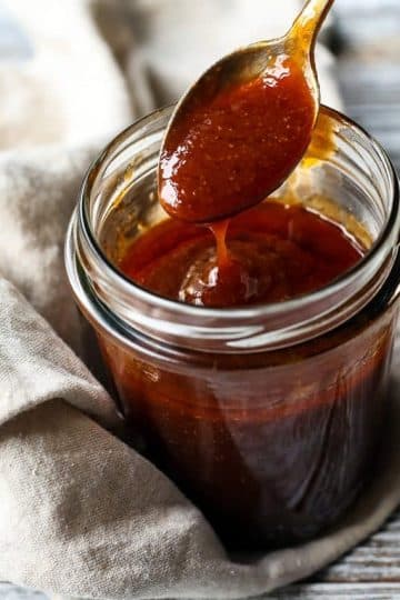 cropped-Vegan-Buffalo-Sauce-in-a-Jar-with-a-Spoon-Closeup-1.jpg