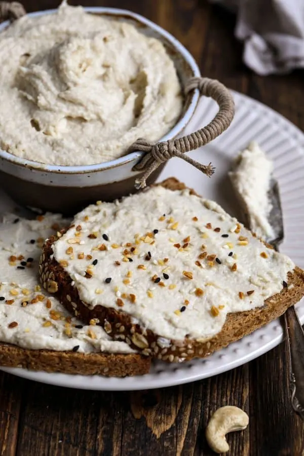 Vegan Cream Cheese on a Slice of Bread with a Bowl