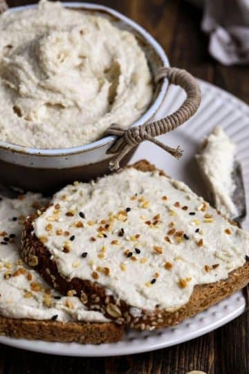 cropped-Vegan-Cream-Cheese-on-a-Slice-of-Bread-with-a-Bowl.jpg